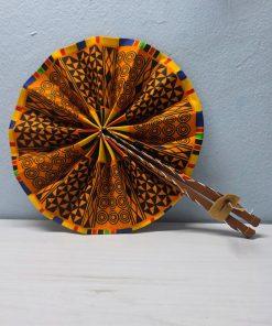 Ashanti Symbols African Fan made from authentic 100% African wax cotton fabric, featuring a pattern inspired by traditional Ashanti symbols, a wooden handle, and leather details.