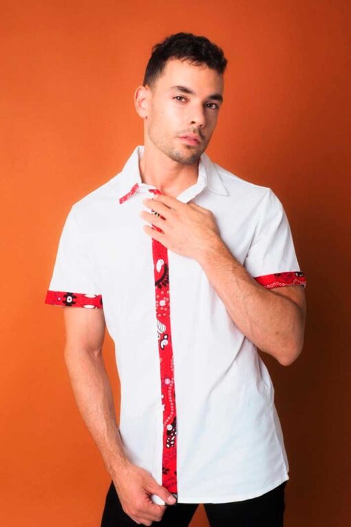 The combination of colors and patterns in this short sleeve shirt in African fabric is simply spectacular.