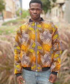 African bomber jacket Aṣé Wave in wax fabric with blue and gold geometric wave patterns, unisex design.